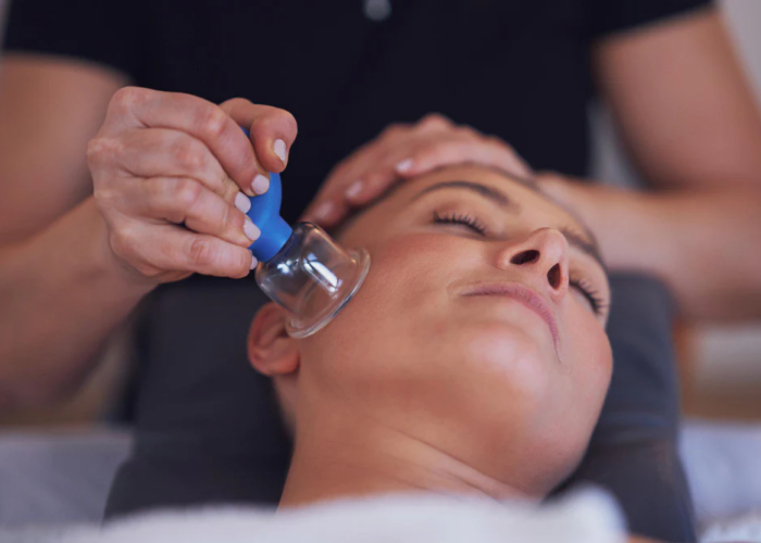 woman-having-face-cupping-massage-salon