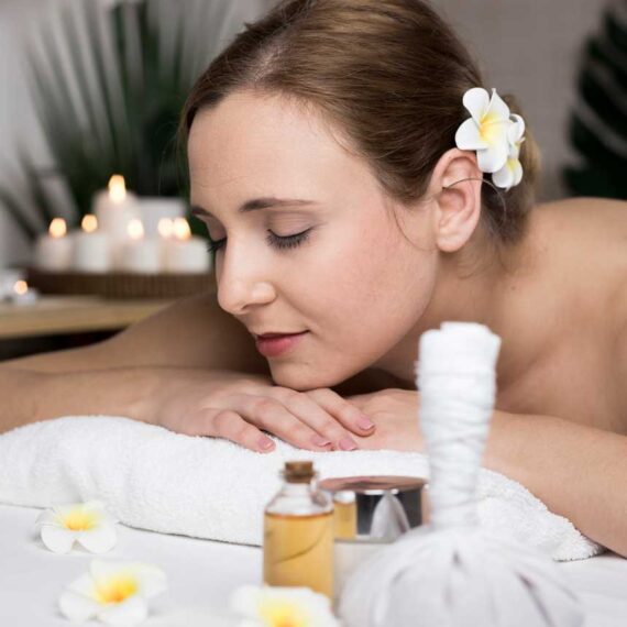 woman-receiving-massage-spa-center
